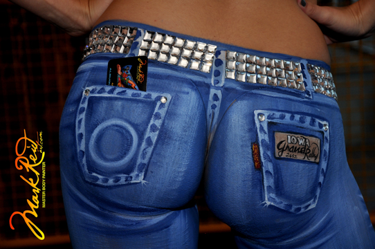 very close image of the rear of a woman painted in detailed jeans